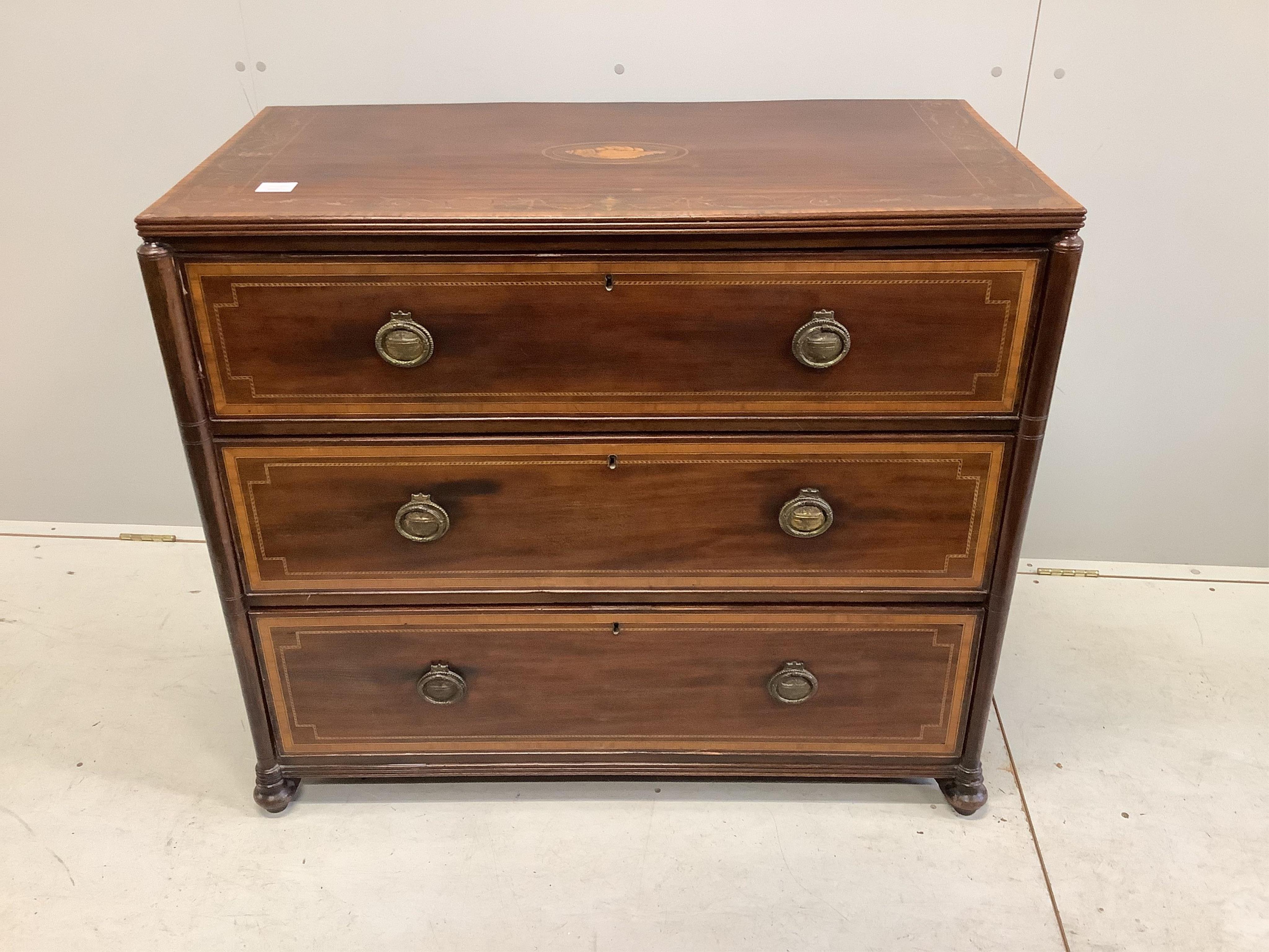 A 19th century later inlaid mahogany chest of three drawers, bears S & H Jewell retail label, width 101cm, depth 52cm, height 87cm. Condition - fair